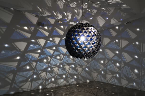 image of group show installation view, eliasson light sculpture