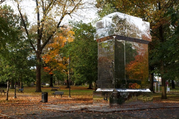 image of reflective panels structure covering monument