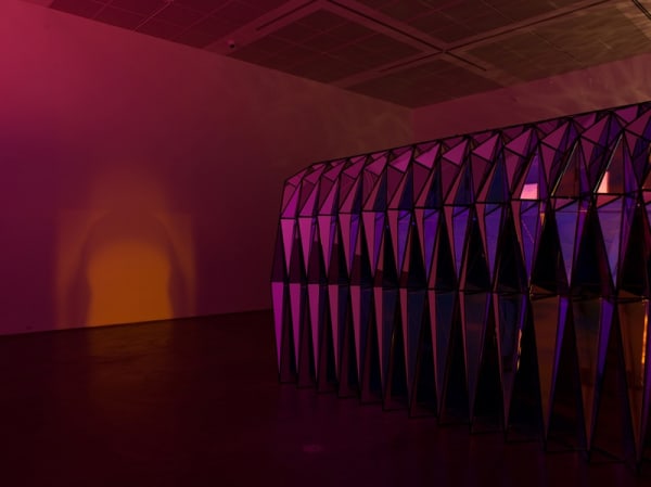 image of three sculptures in darkened room