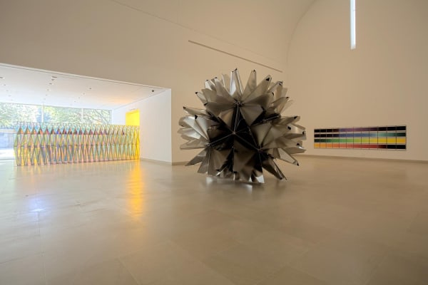 image of sculptural object and photographs