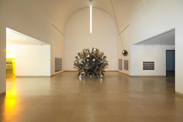 image of sculptural object and photographs