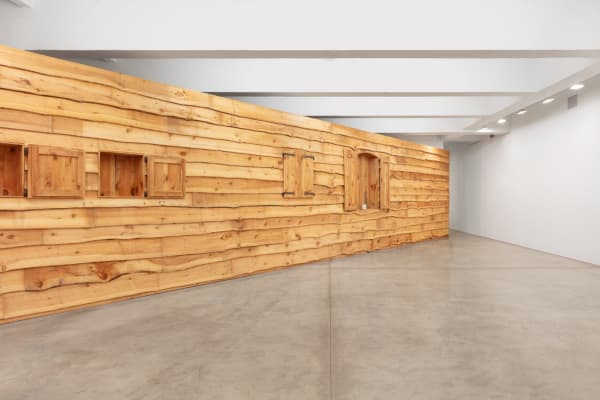 installation image with large wall rustic wall