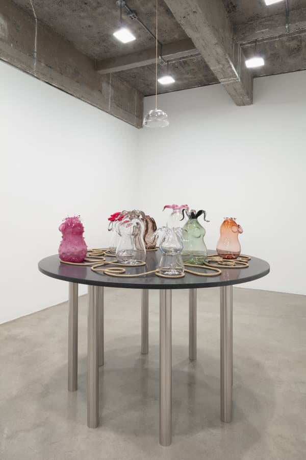 Akashi sculpture, glass objects on table