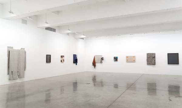 Laura Lima tailor shop install photo - portraits