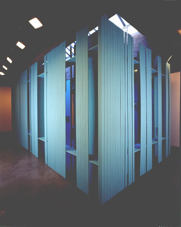 Cinto blue structure under skylight with photographs