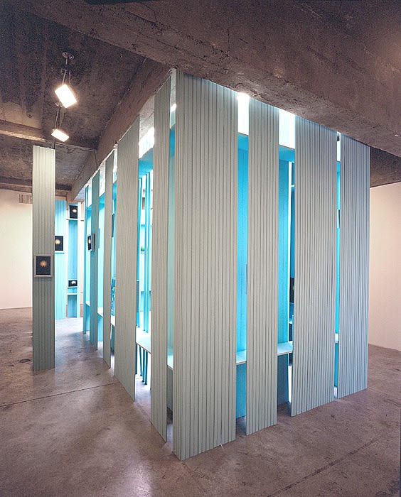 Cinto blue structure under skylight with photographs