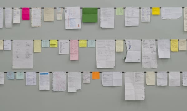Rivane install of hanging unframed paper