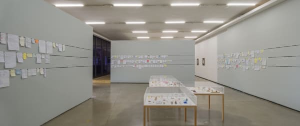 Rivane install of hanging unframed paper