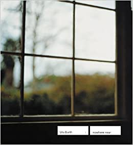 Exhibition catalogue for Uta Barth exhibition "nowhere near". Blurred photo of a wooden window pane looking out on a garden and bare trees in the distance.