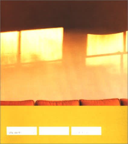 Exhibition catalogue cover for 2000 Uta Barth exhibition "...and of time". Shadow of window panes on yellow wall above the tops of square orange cushions. Text on white rectangles on yellow background: Uta Barth, and in time
