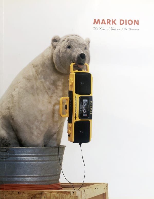 Exhibition catalogue cover for Mark Dion exhibition. Photo of a toy stuffed polar bear sitting in a tin bucket and holding a boom box in its mouth. Title text: "Mark Dion, The Natural History of the Museum"