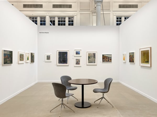 art fair booth with various framed artworks on the wall