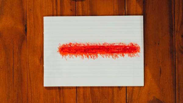 Mauro Yamaguti x minutos de desenho - tempo da performance, 2024 Desenho - Resquício de performance transcrevendo a leitura de texto longo com caneta vermelha sobre caderno de caligrafia. 14 x 20 x 1 cm