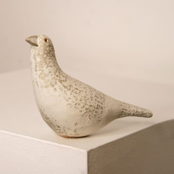 Jane Muir minimalist ceramic sculpture of a snow bird, with a speckled white matte glaze