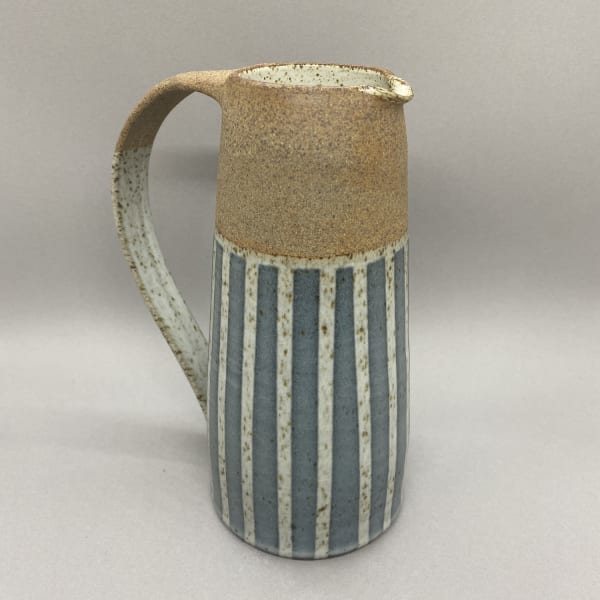 Kate Garwood tall jug in a straight shape with a pale blue body and vertical white stripes.