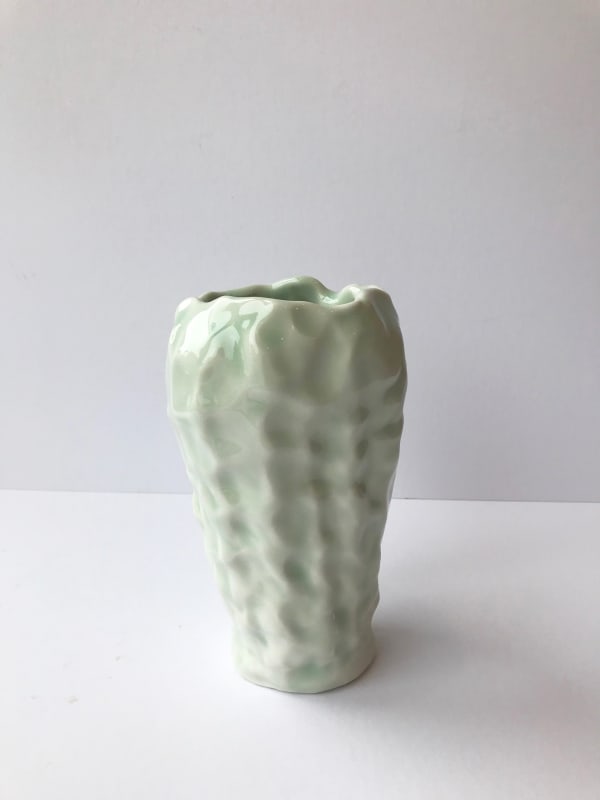 Emma Jagare hand built porcelain mint green small vase with rippled dimensional detail.