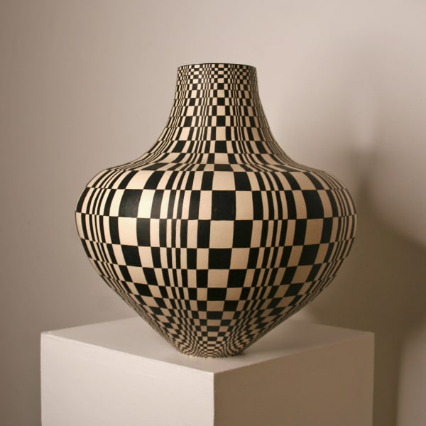 Ant & Di Edmonds of Tydd Pottery ceramic vessel with a rounded body and narrowed neck and hand painted geometric optical illusion pattern