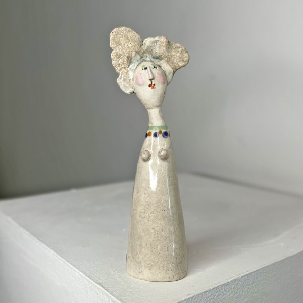 Jane Muir little man ceramic sculpture with stone white glaze and green collar