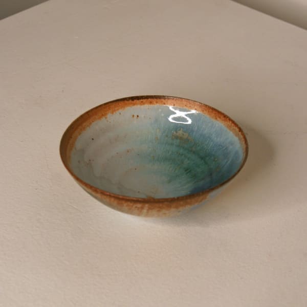 Atilla Olah ceramic mini bowl in a variety of blue, green, grey and copper glaze colours