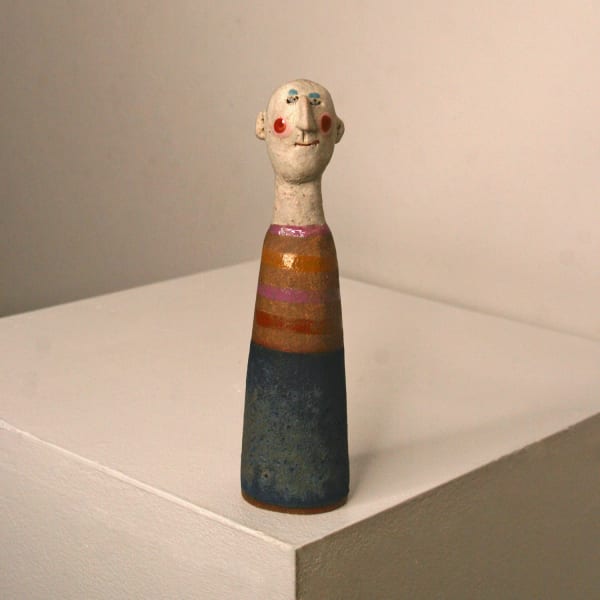 Jane Muir minimalist ceramic sculpture of a little man, in navy, orange and pink glazes