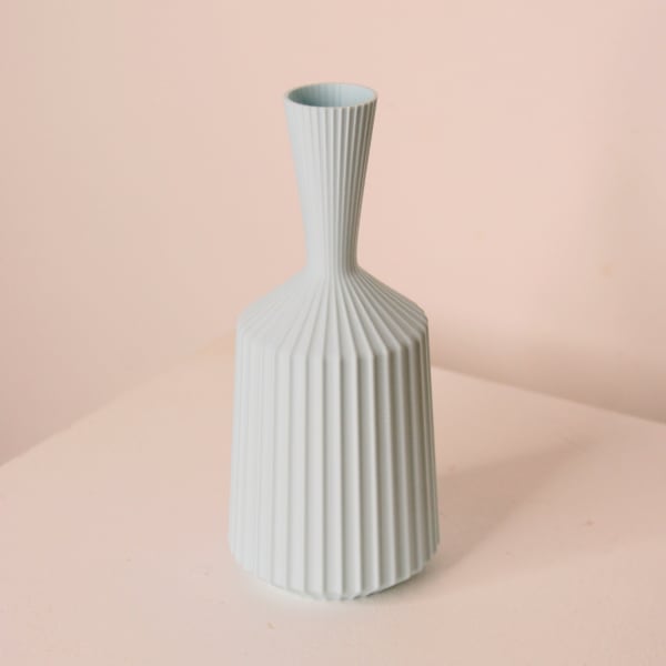 Keeley Traae 3d printed PLA vase in a pinched cone shape and dimensional zig-zagged texture, ice blue