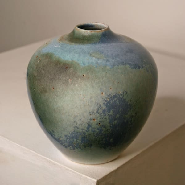 Atilla Olah ceramic vase in a variety of blue, green, grey and copper glaze colours