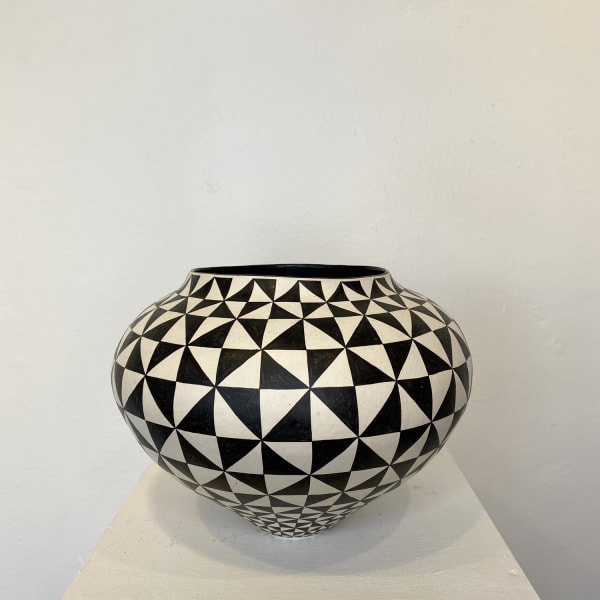 Ant & Di Edmonds - Tydd Pottery wide, heart shaped ceramic black and white vessel with a vertical zig zag pattern. wide round ceramic pot decorated in a black and white triangle pattern.