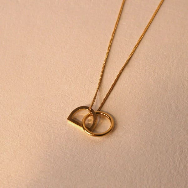 Claire Lowe Jewellery gold vermeil necklace with circle and semi-circular pendant