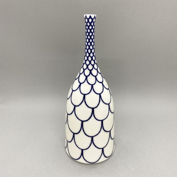 Rhian Malin medium white straight sided Bottle vase with scalloped design in blue.