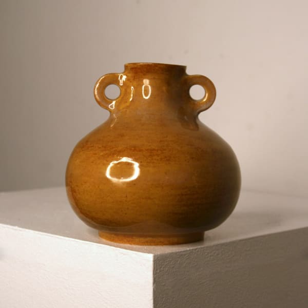 Lucy Physick stoneware ceramic tear drop shaped vase in an ochre glaze