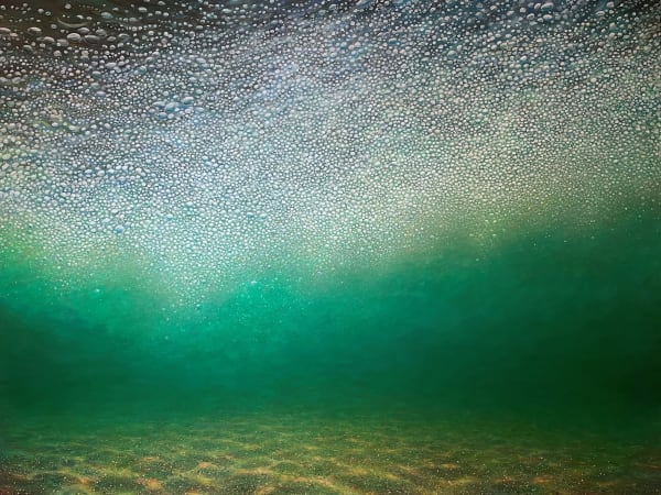 Jim Whitty underwater painting of the sandy bed of the ocean is illuminated by the light coming through the water, sparkling at the top and a verdant green in the middle