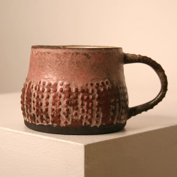 Elly Wall stoneware ceramic mug with raised bumped texture and red glaze
