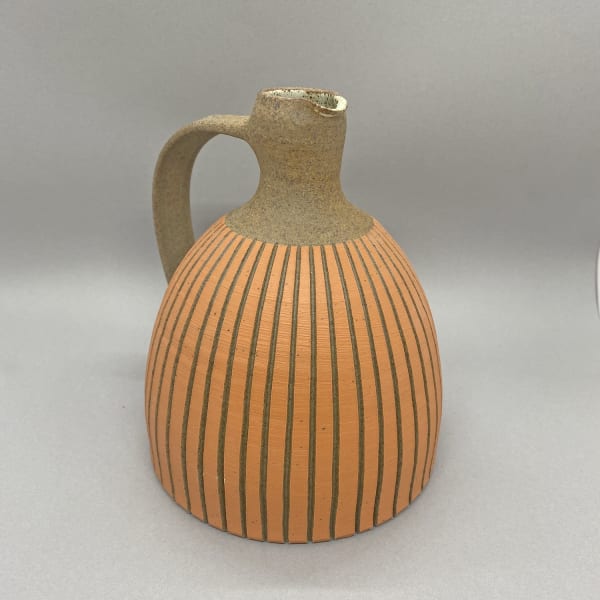Kate Garwood brown jug with an orange body and tall neck.