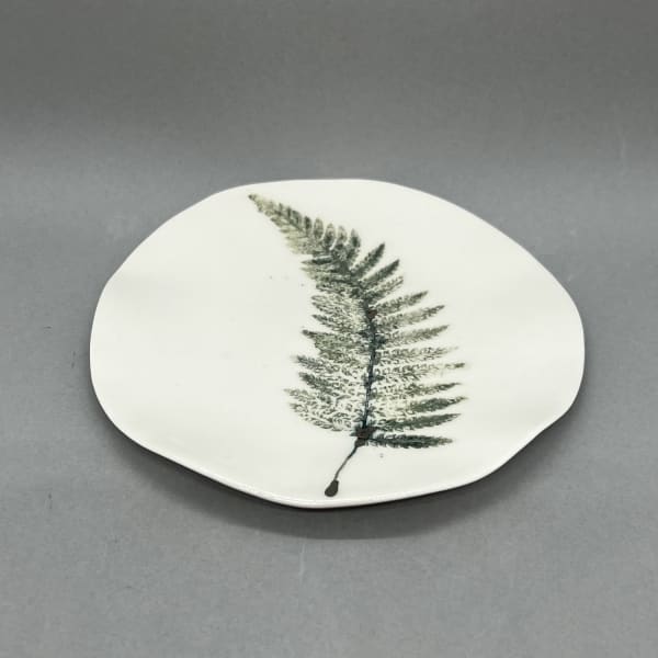 Fliff Carr white ceramic plate with a green fern leaf design printed