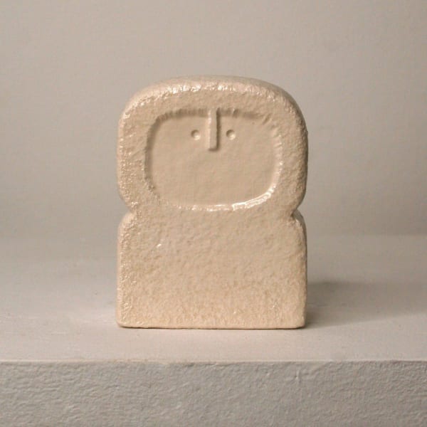 Peter Slight ceramic slip-cast bust of a circular head with abstracted face and egg shell white glaze on a plinth base
