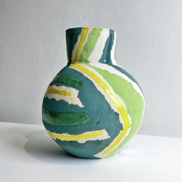 Eddie Knevett ceramic vessel designed with shaped in colours green and yellow