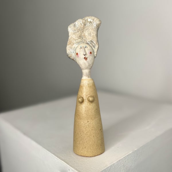 Jane Muir little lady sculpture in yellow glaze and white spotted collar