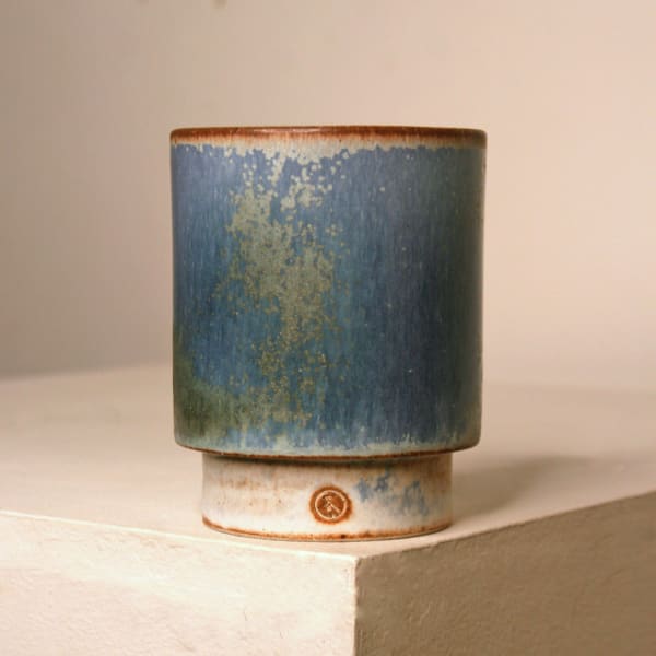 Atilla Olah ceramic yunomi cup in a variety of blue, green, grey and copper glaze colours