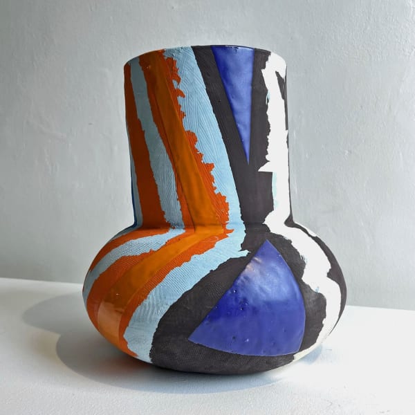 Eddie Knevett ceramic vessel designed with shaped in colours blue, orange, black and white