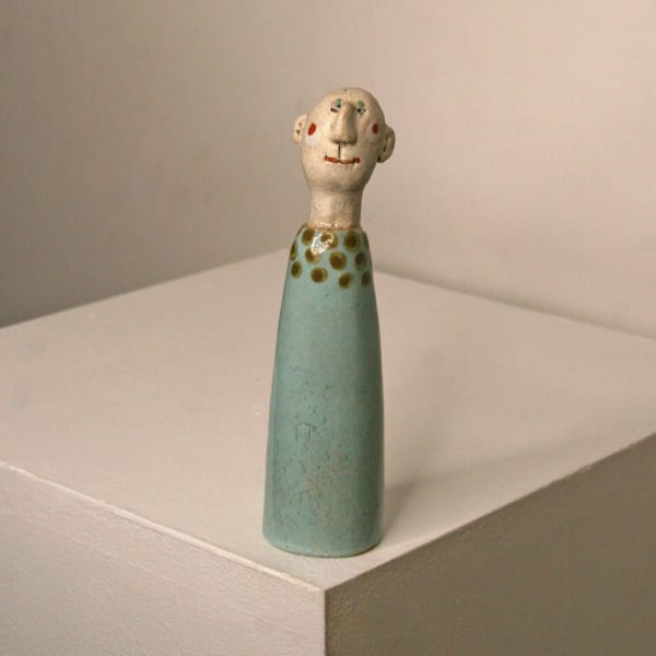 Jane Muir minimalist ceramic sculpture of a little man, aqua with Olive dotted collar
