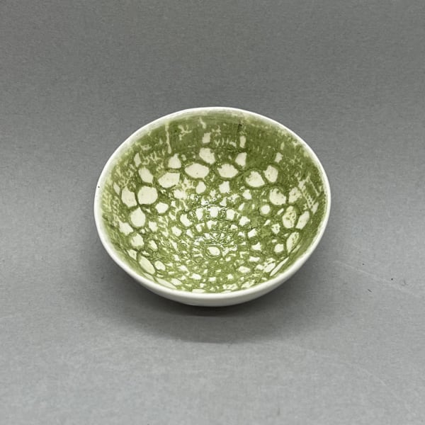 Fliff Carr ceramic bowl in white with green lace detail printed pattern.