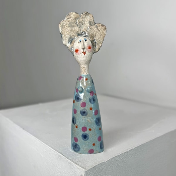 Jane Muir little lady sculpture with pale blue glaze and blue and lilac dots