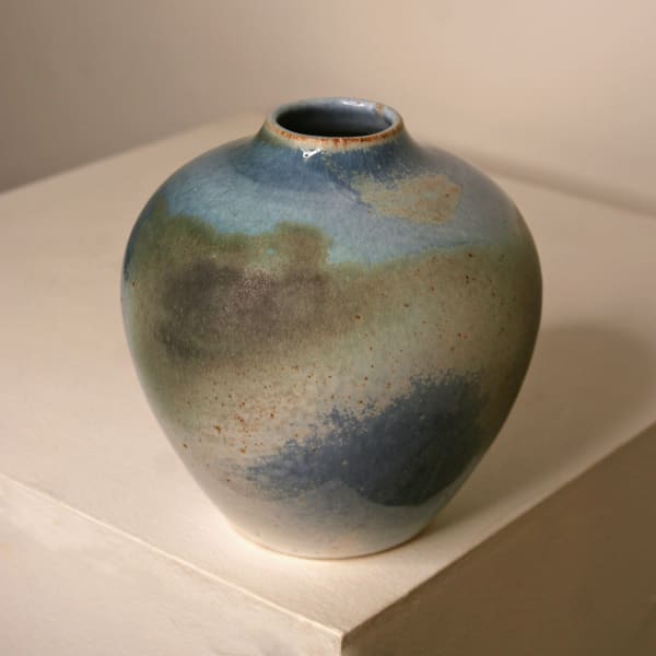 Atilla Olah ceramic vase in a variety of blue, green, grey and copper glaze colours
