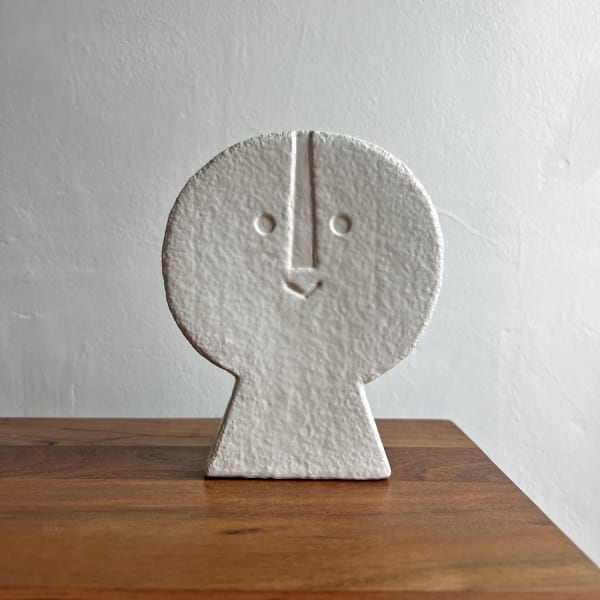 Peter Slight ceramic bust of a circular head with an abstracted face in eggshell white