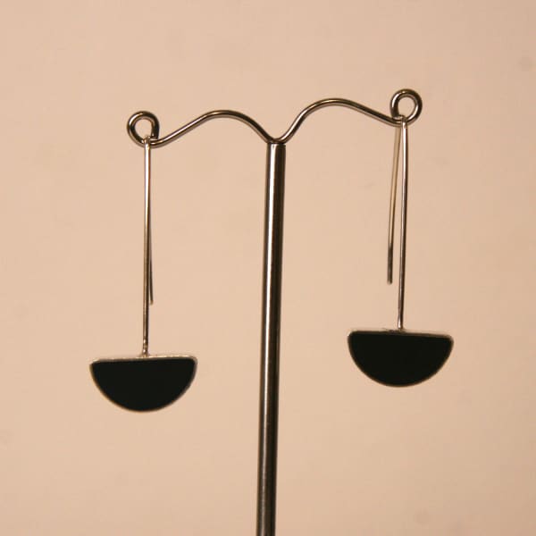 Claire Lowe resin jewellery, silver drop style earring hooks with semi-circular black resin pendant at the bottom