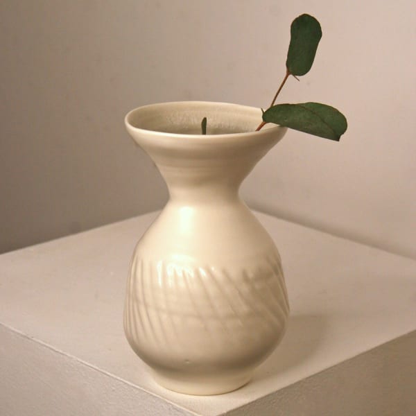 Linda Bloomfield small white vase with a curvature in the centre and fluted lines