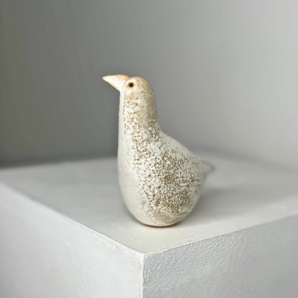 Jane Muir ceramic snow bird with tilted head, stoneware and mottled white glaze