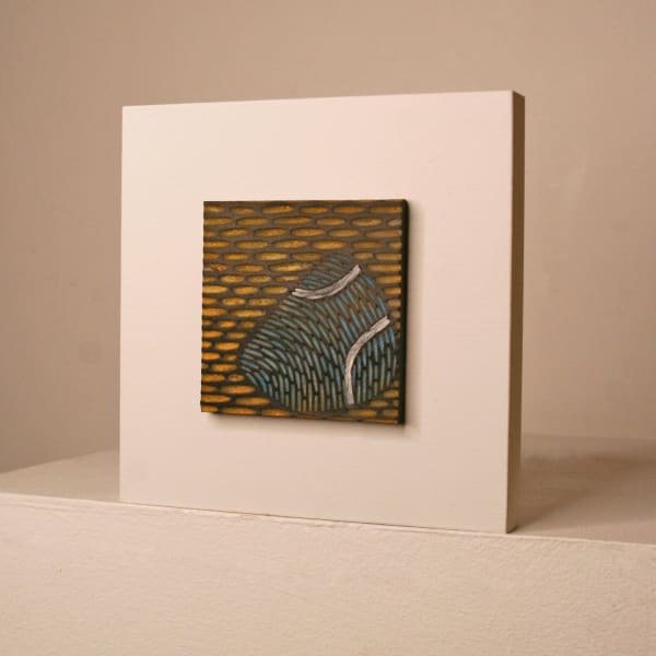 Janine Partington wooden panel with Carved leather design of a pebble