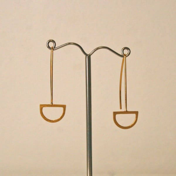 Claire Lowe Jewellery drop style earrings in gold vermeil with semi-ciruclar pendant at the bottom