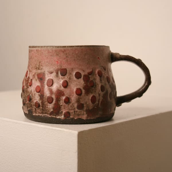 Elly Wall stoneware ceramic mug with raised bumped texture and red glaze